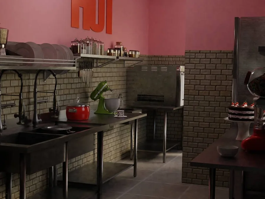Cozinha industrial com bancadas de inox, parede rosa e revestimento de tijolinho.